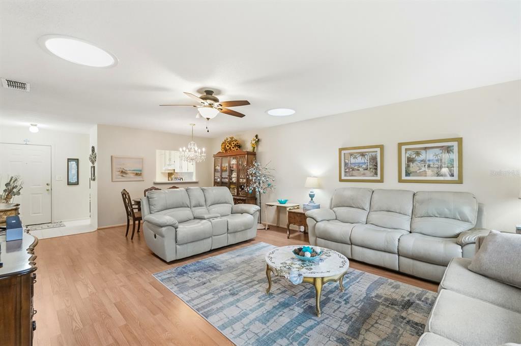 41 Crooked Pine Road Port Orange, FL 32128 - Photo 8 of 40 a living room with furniture and a wooden floor