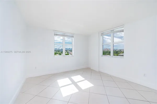 a view of an empty room with a window