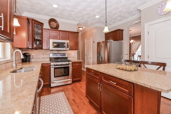 83 Scenic Way Exeter, RI 02822 - Photo 11 of 24 a kitchen with stainless steel appliances granite countertop a stove a sink and a microwave