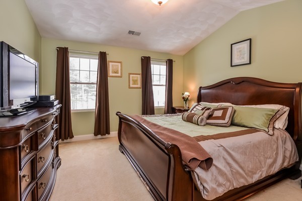 83 Scenic Way Exeter, RI 02822 - Photo 14 of 24 a bedroom with a large bed and a flat tv screen on dresser