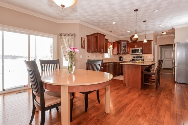 83 Scenic Way Exeter, RI 02822 - Photo 3 of 24 a view of a dining room with furniture window and wooden floor