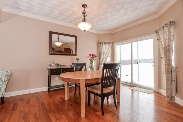 83 Scenic Way Exeter, RI 02822 - Photo 8 of 24 a view of a dining room with furniture window and wooden floor