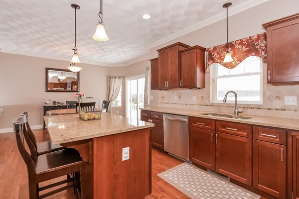 83 Scenic Way Exeter, RI 02822 - Photo 9 of 24 a kitchen with sink cabinets and window
