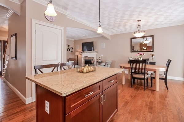 83 Scenic Way Exeter, RI 02822 - Photo 10 of 24 a dining table with chairs and wooden floor