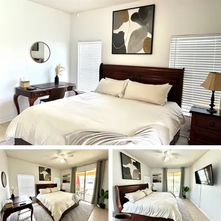 a bedroom with a large bed and white walls