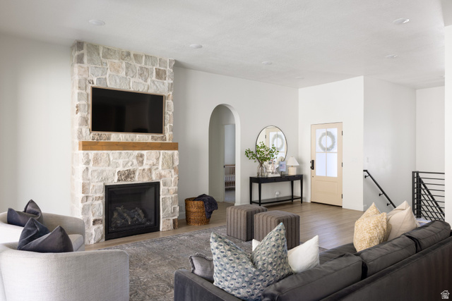 965 Johnson Lane Logan, UT 84321 - Photo 2 of 5 Stone-clad fireplace with a wood mantle