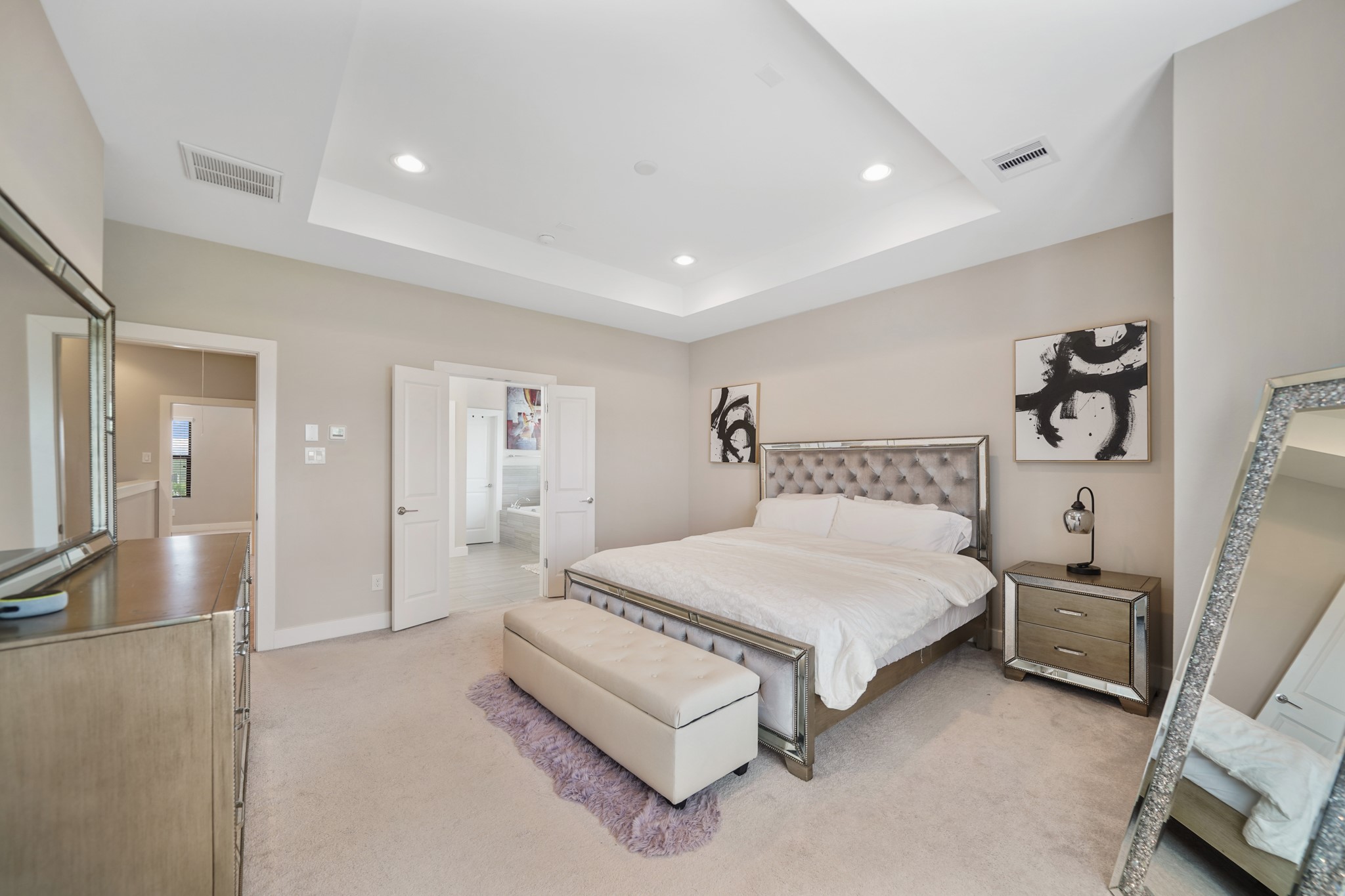 1824 Bonner Street Houston, TX 77007 - Photo 24 of 39 a spacious bedroom with a bed and a large mirror