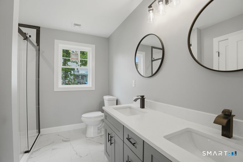 796 Maple Hill Road Naugatuck, CT 06770 - Photo 24 of 35 a bathroom with a sink and a mirror