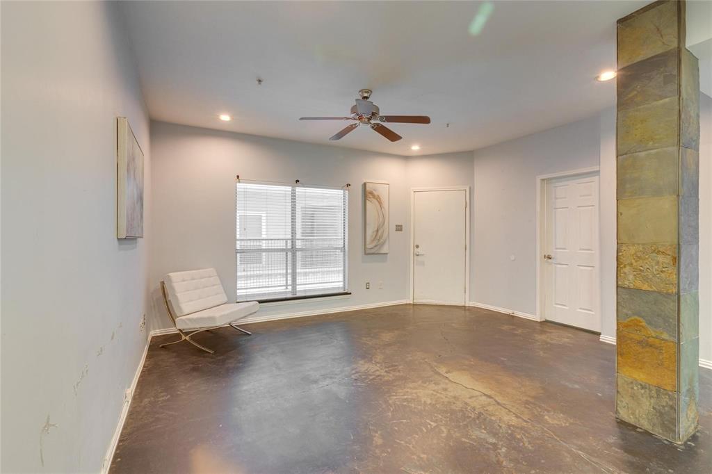 4104 North Hall Street, Unit 102 Dallas, TX 75219 - Photo 10 of 18 Spacious living area featuring polished concrete flooring, recessed lighting, and a ceiling fan