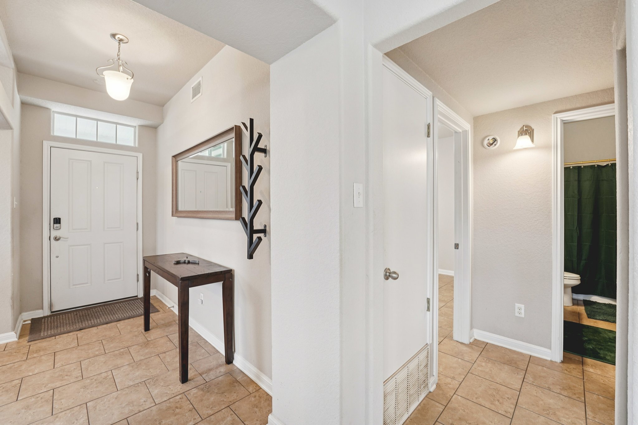 1048 Sanders Kyle, TX 78640 - Photo 2 of 18 a view of an entryway with wooden floor