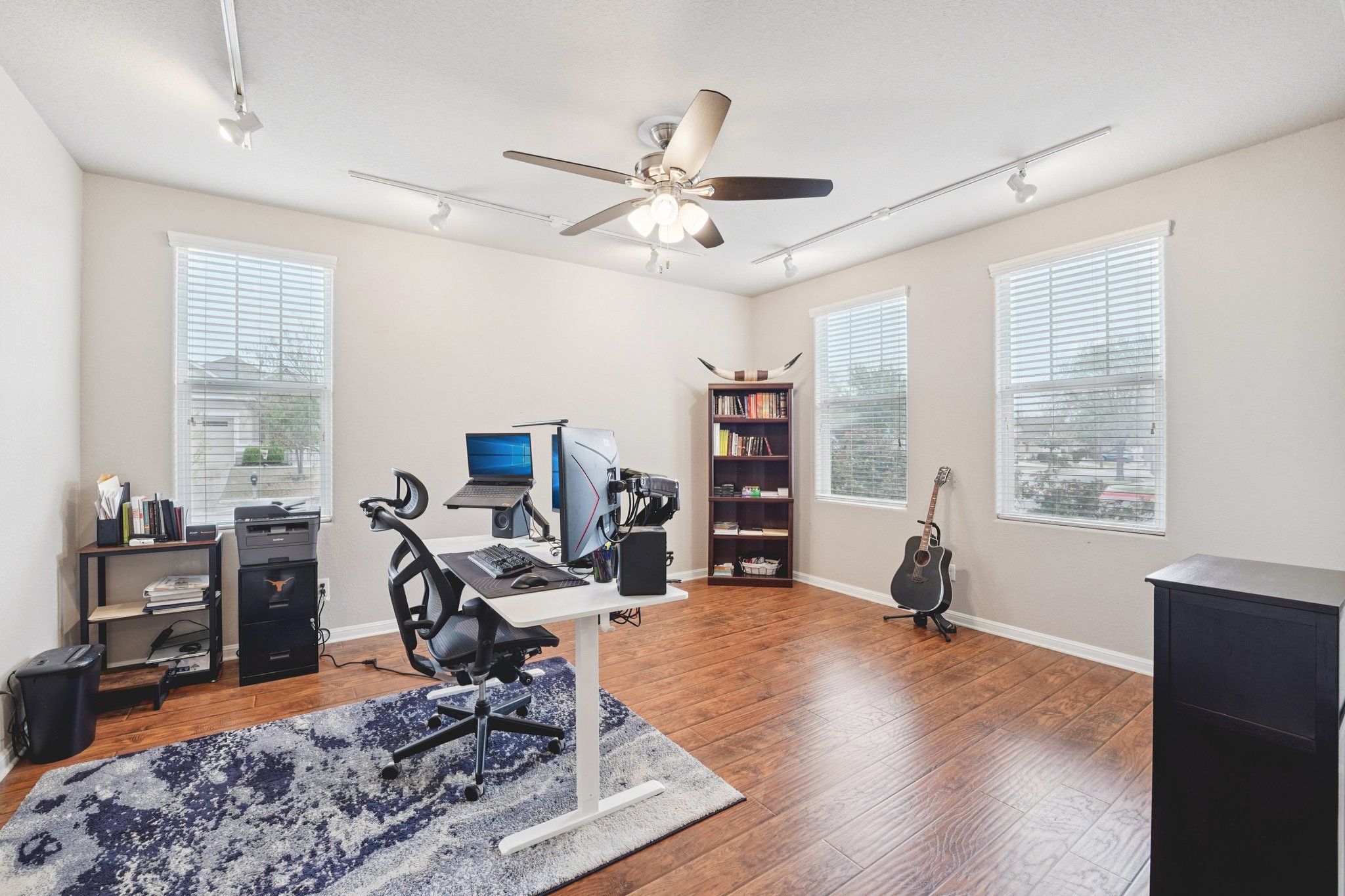 1048 Sanders Kyle, TX 78640 - Photo 7 of 18 a view of a workspace with furniture and a window