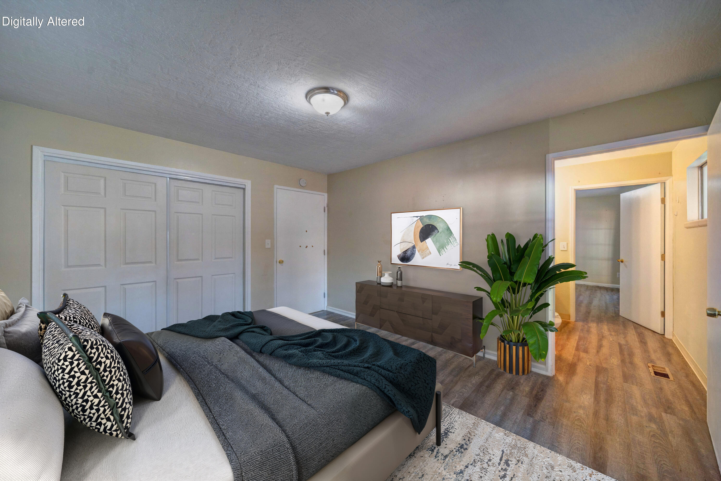 920 Hallmark Drive Redding, CA 96001 - Photo 17 of 34 a bedroom with a bed and a potted plant