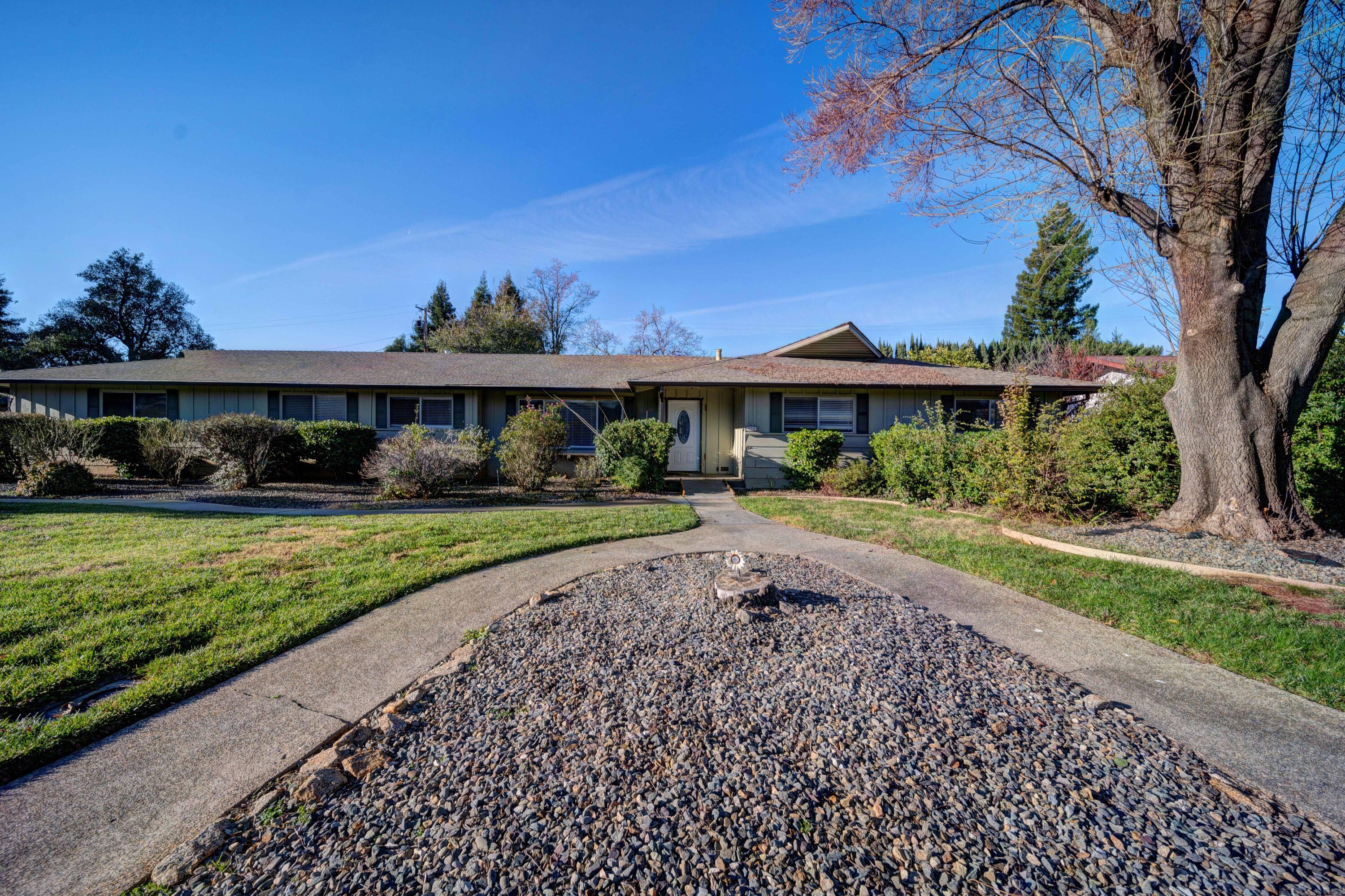 920 Hallmark Drive Redding, CA 96001 - Photo 2 of 34 a front view of a house with a yard