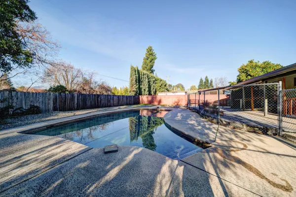 a view of a roof deck with wooden fence