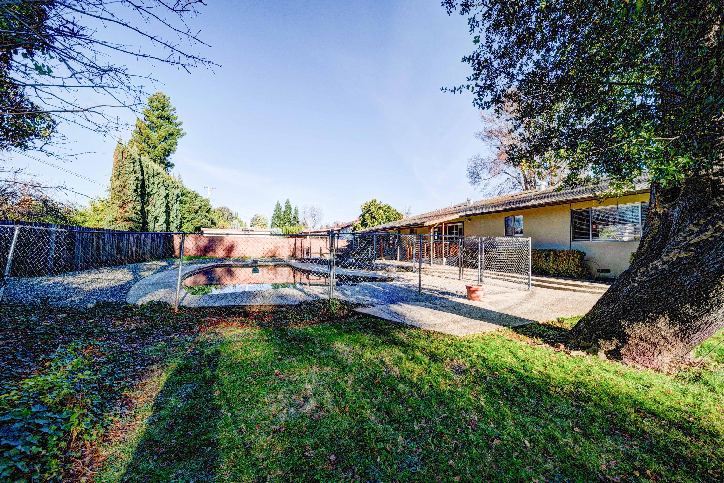920 Hallmark Drive Redding, CA 96001 - Photo 27 of 34 a view of a house with backyard and sitting area