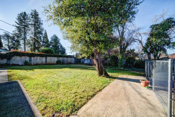 a view of a swimming pool with a yard
