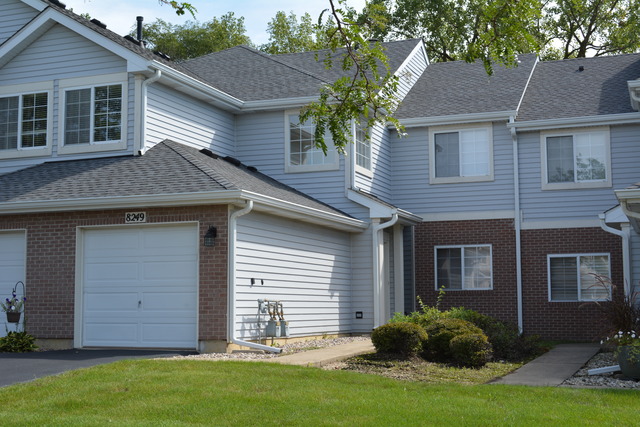 8249 Ripple Ridge Darien, IL 60561 - Photo 1 of 27 a view of a house with a yard