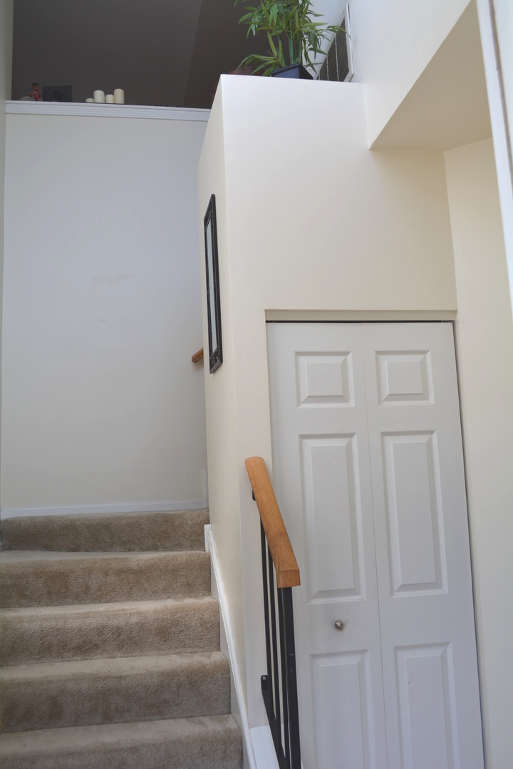 8249 Ripple Ridge Darien, IL 60561 - Photo 2 of 27 a view of staircase with white walls