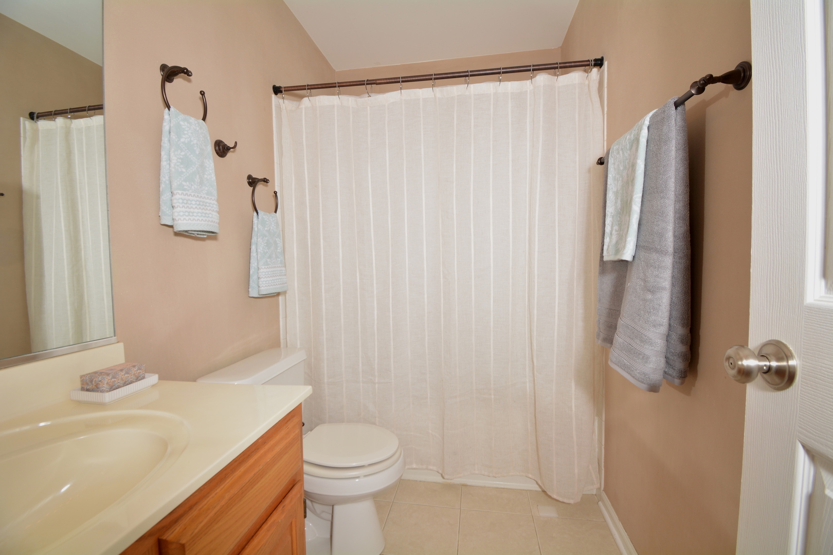8249 Ripple Ridge Darien, IL 60561 - Photo 18 of 27 a bathroom with a sink a toilet and shower