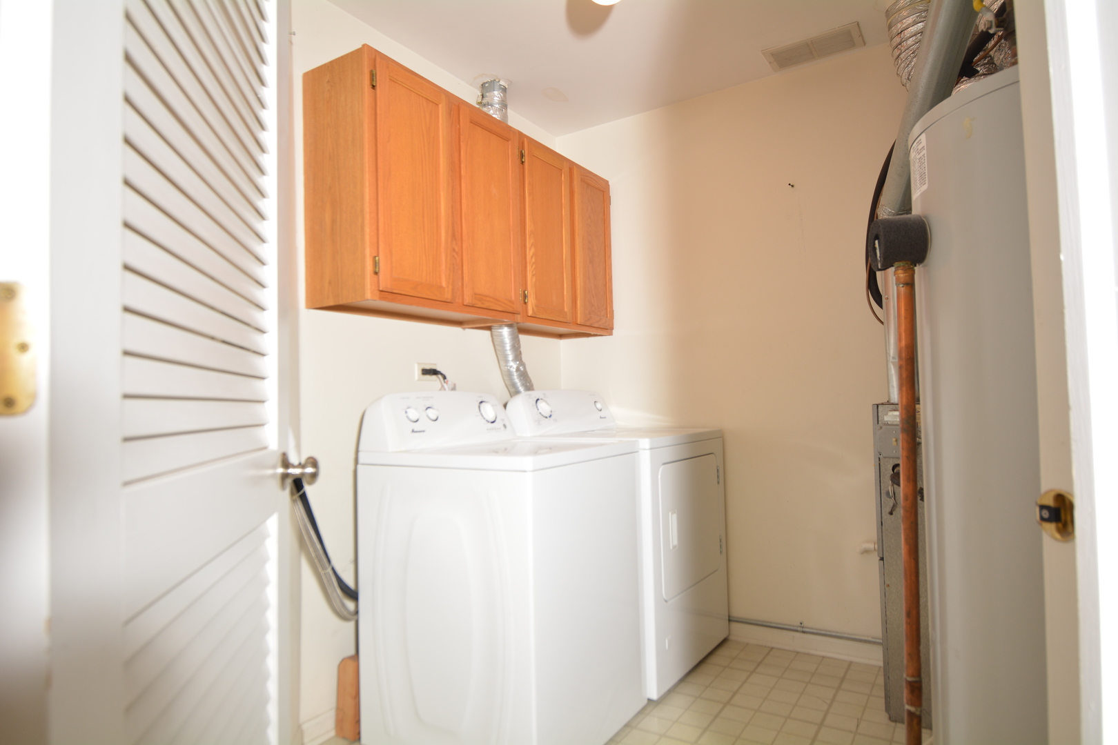 8249 Ripple Ridge Darien, IL 60561 - Photo 25 of 27 a utility room with dryer and washer