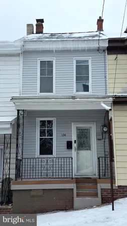 a front view of a house with a porch