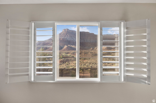 1440 West 100 South Virgin, UT 84779 - Photo 24 of 45 Window with white plantation shutters, offering expansive mountain scenery