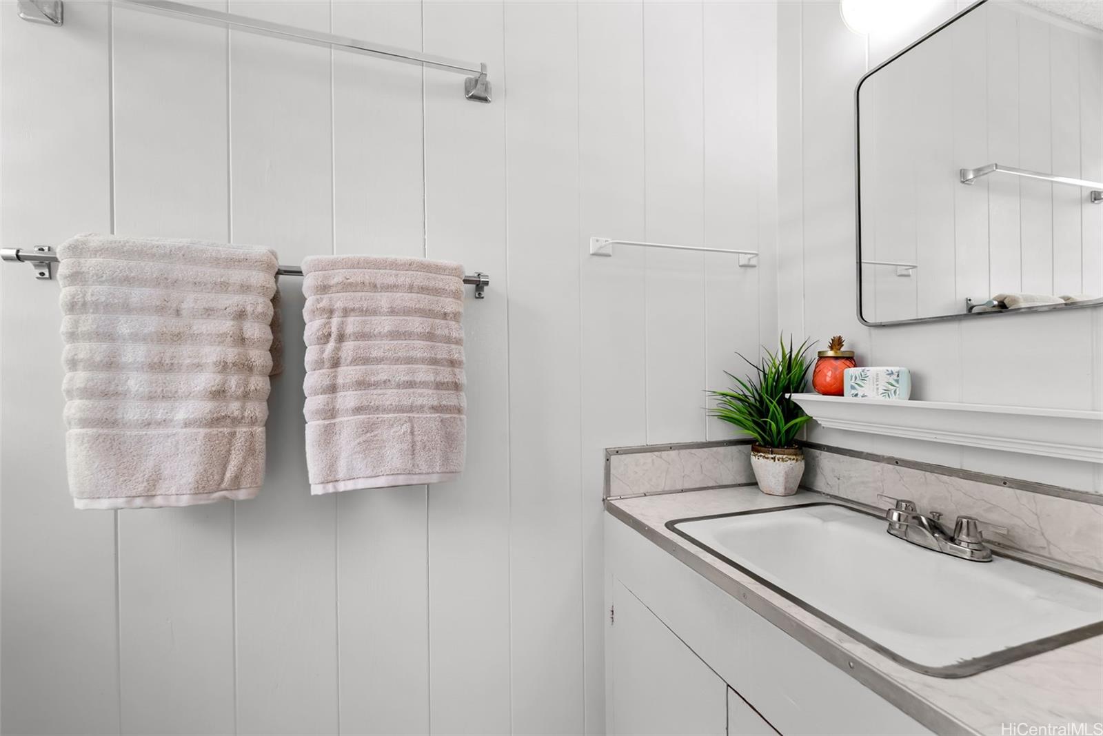 6014 Aimoku Street Honolulu, HI 96821 - Photo 22 of 25 Half bath is attached to the primary bedroom