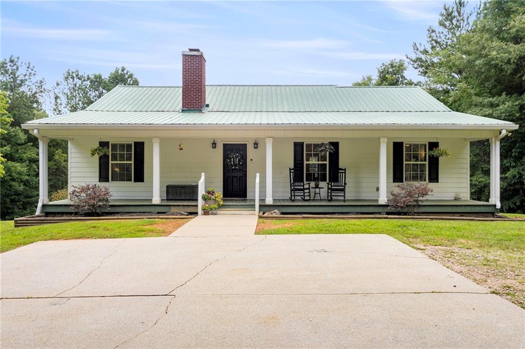 1915 Rainey Road Temple, GA 30179 - Photo 1 of 1 a view of a house with swimming pool and a porch
