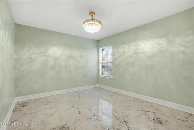 a view of an empty room and window