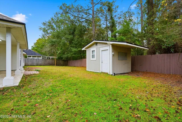 a backyard of a house with lots of green space