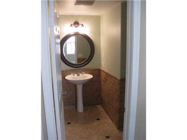 224 Manzanilla Way Oceanside, CA 92057 - Photo 10 of 22 One half bath down. Veruy attractive room. There is also a full bath down! handy for parties!