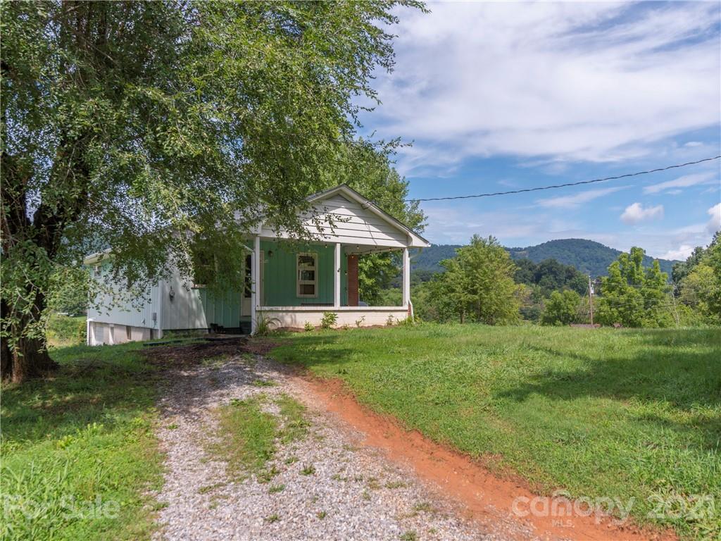 358 Coffee Branch Road Canton, NC 28716 - Photo 2 of 19 a front view of a house with a yard