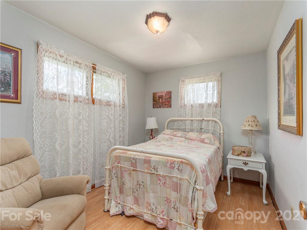 358 Coffee Branch Road Canton, NC 28716 - Photo 13 of 19 a bedroom with a bed and a couch