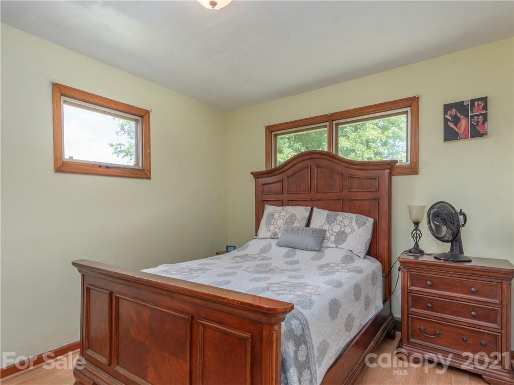 358 Coffee Branch Road Canton, NC 28716 - Photo 14 of 19 a bedroom with a bed and a window