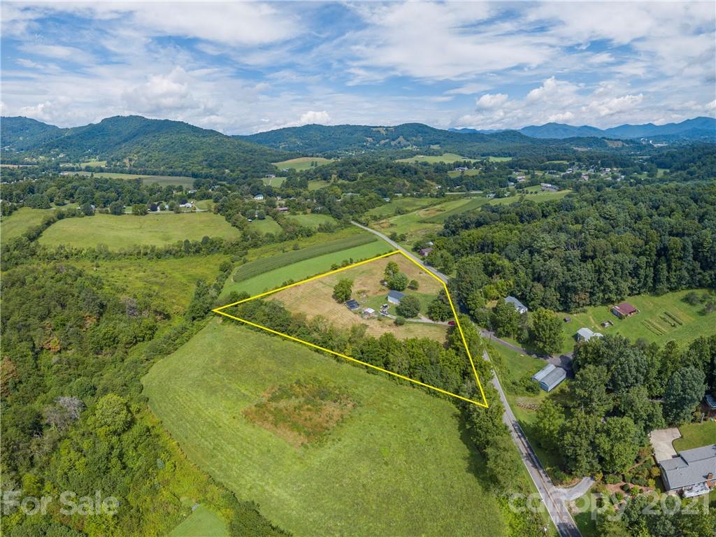 358 Coffee Branch Road Canton, NC 28716 - Photo 4 of 19 a view of a lake with a mountain in the background