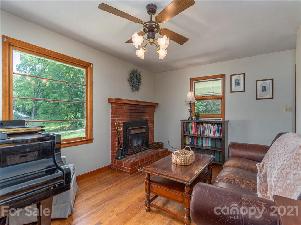 358 Coffee Branch Road Canton, NC 28716 - Photo 6 of 19 a living room with furniture and a fireplace