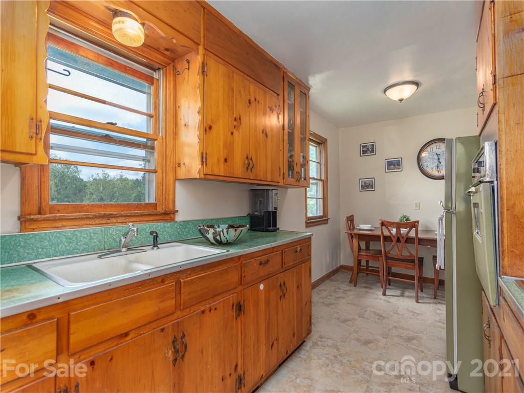 358 Coffee Branch Road Canton, NC 28716 - Photo 8 of 19 a kitchen with granite countertop a sink and a cabinets