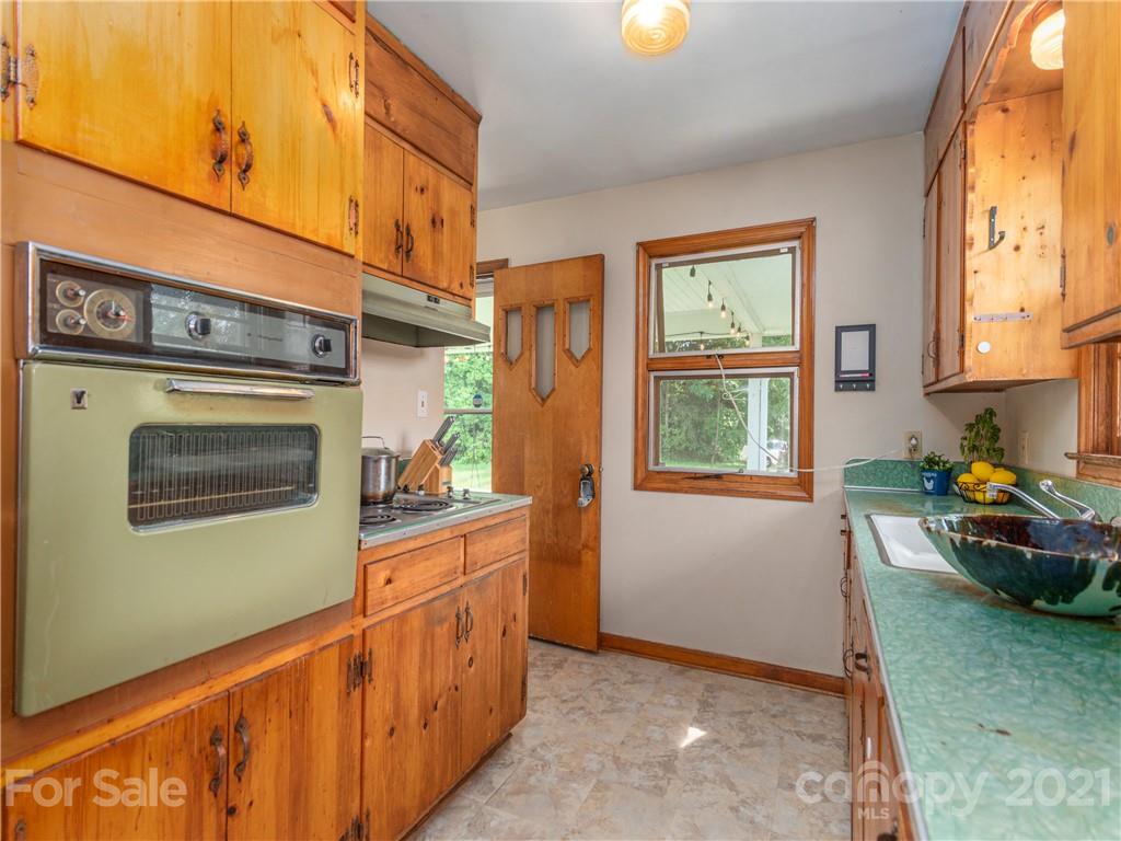 358 Coffee Branch Road Canton, NC 28716 - Photo 9 of 19 a kitchen that has a lot of cabinets in it