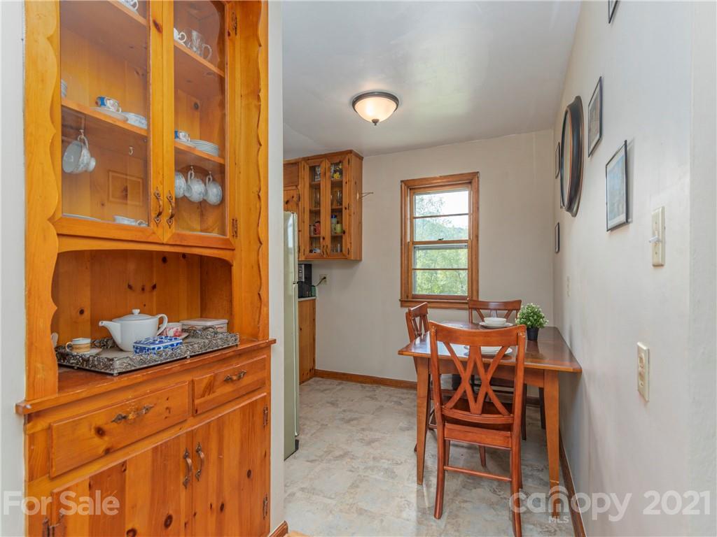 358 Coffee Branch Road Canton, NC 28716 - Photo 10 of 19 a dining room with furniture and window