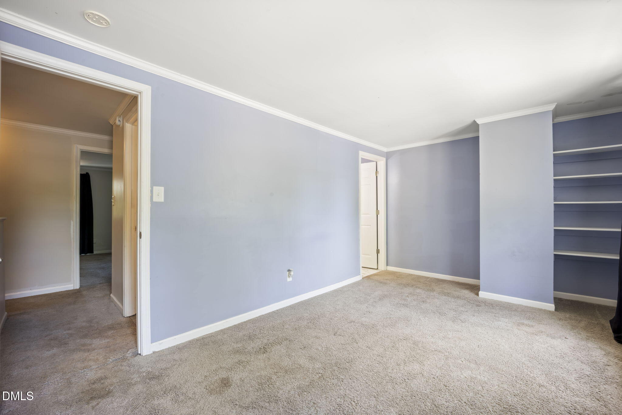 7728 Crown Crest Court Raleigh, NC 27615 - Photo 15 of 38 a view of an empty room and closet area