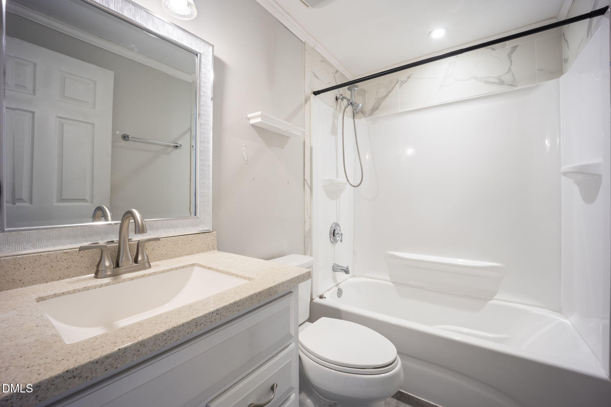 7728 Crown Crest Court Raleigh, NC 27615 - Photo 16 of 38 a bathroom with a sink a toilet and a bathtub