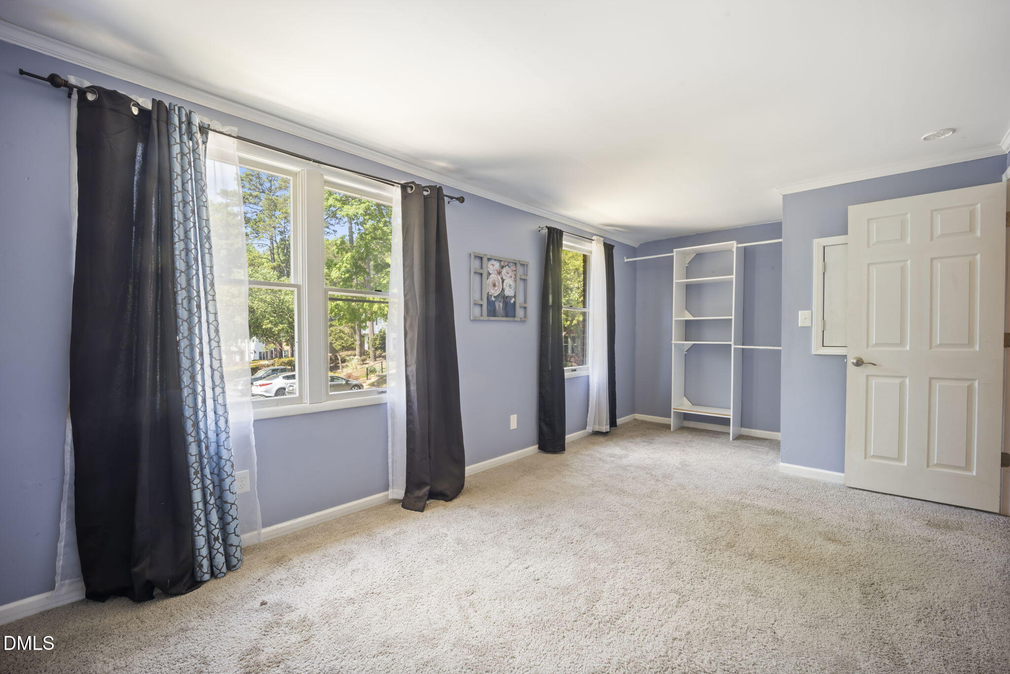 7728 Crown Crest Court Raleigh, NC 27615 - Photo 17 of 38 an empty room with windows and closet