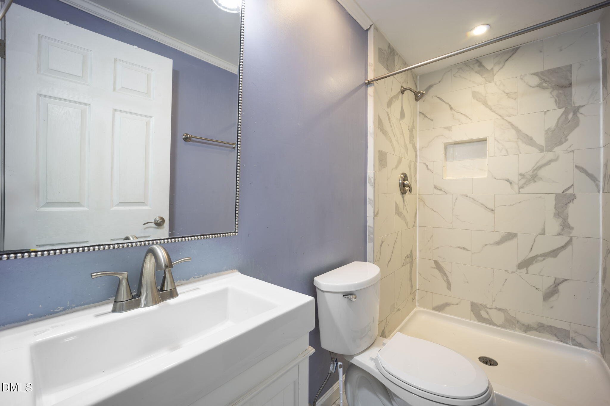 7728 Crown Crest Court Raleigh, NC 27615 - Photo 19 of 38 a bathroom with a sink toilet and shower