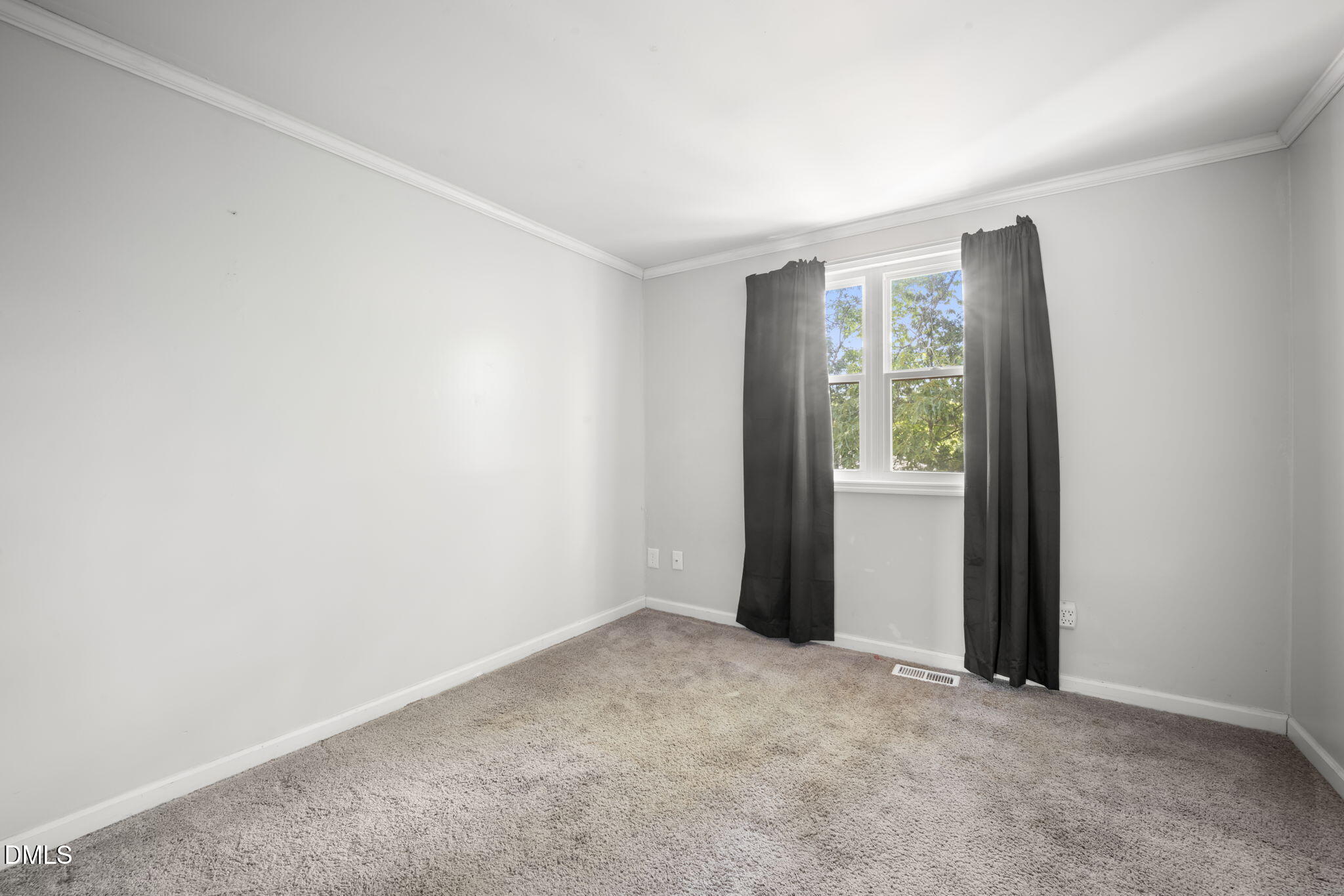 7728 Crown Crest Court Raleigh, NC 27615 - Photo 20 of 38 an empty room with windows and closet