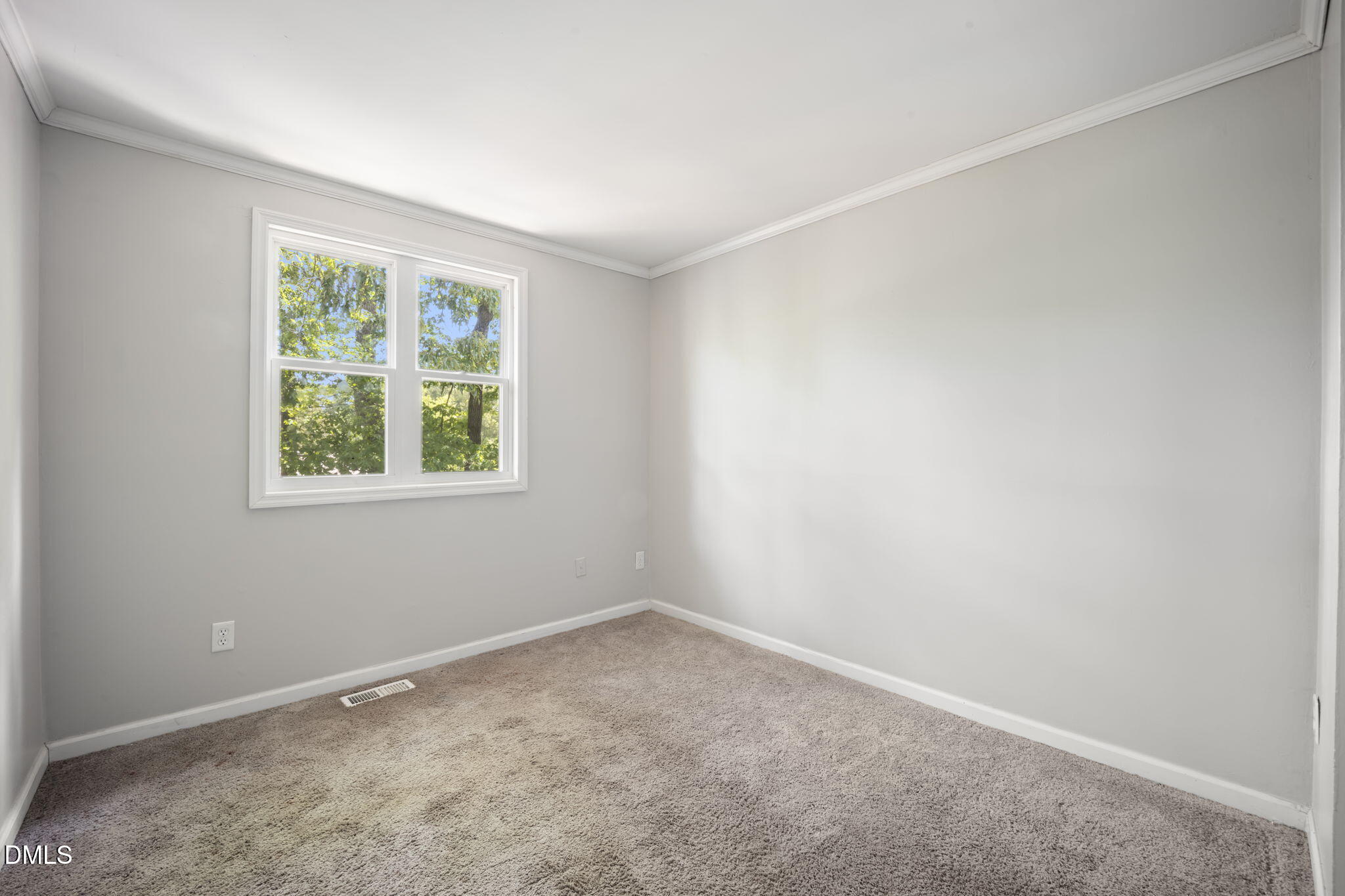 7728 Crown Crest Court Raleigh, NC 27615 - Photo 23 of 38 an empty room with a window