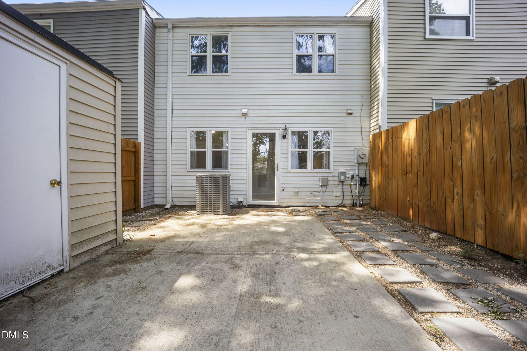 7728 Crown Crest Court Raleigh, NC 27615 - Photo 27 of 38 a view of a house with backyard and wooden fence