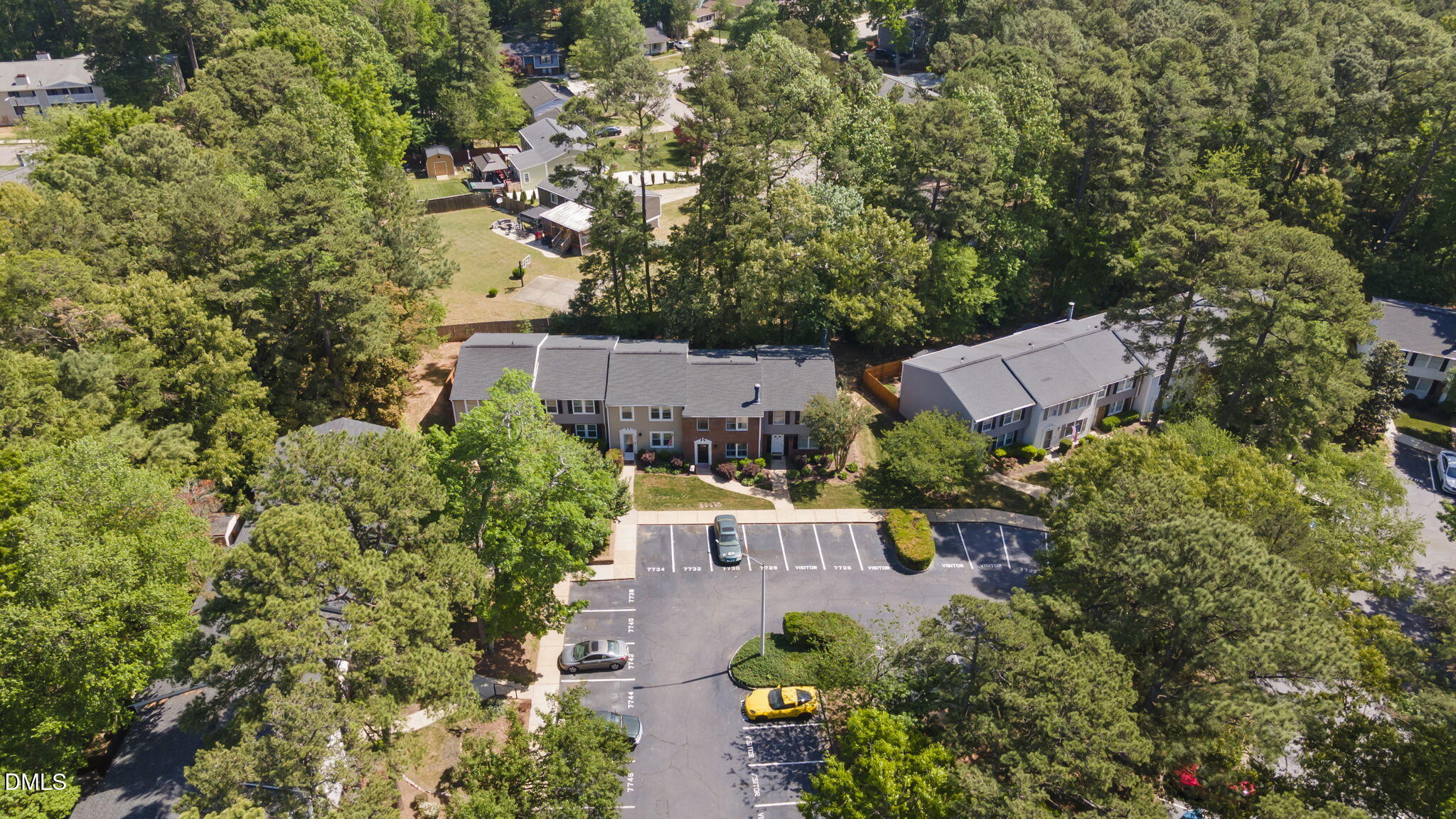 7728 Crown Crest Court Raleigh, NC 27615 - Photo 34 of 38 an aerial view of a house with yard and outdoor seating