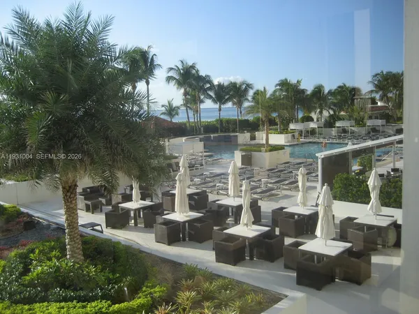 a view of a lake with couches and city view