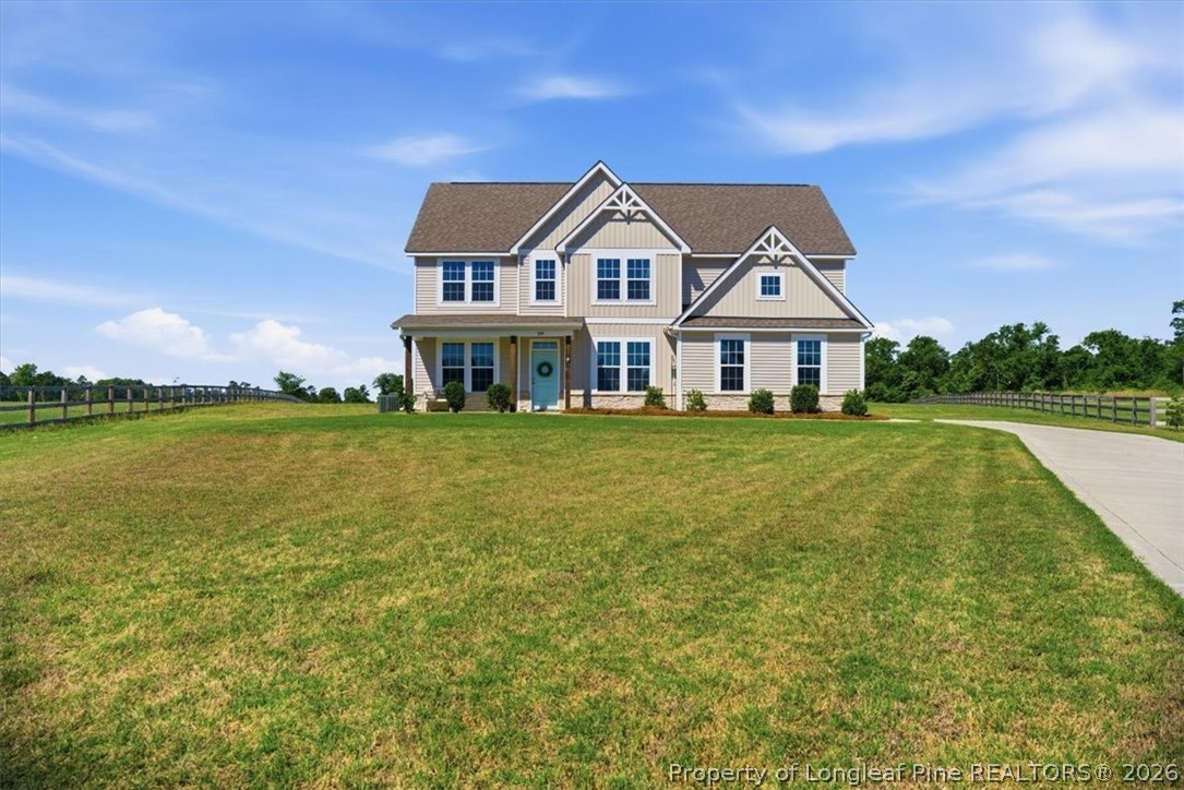 339 Rocking Horse Lane Raeford, NC 28376 - Photo 2 of 47 a view of a house with a big yard