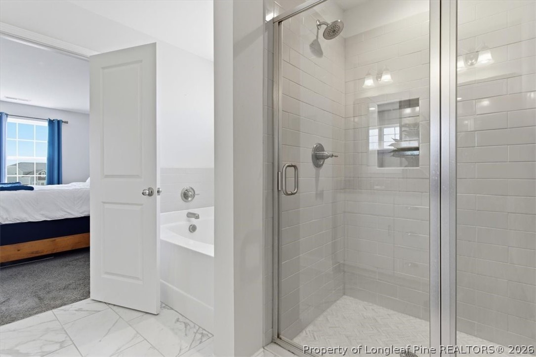 339 Rocking Horse Lane Raeford, NC 28376 - Photo 27 of 47 a bathroom with a shower and a sink